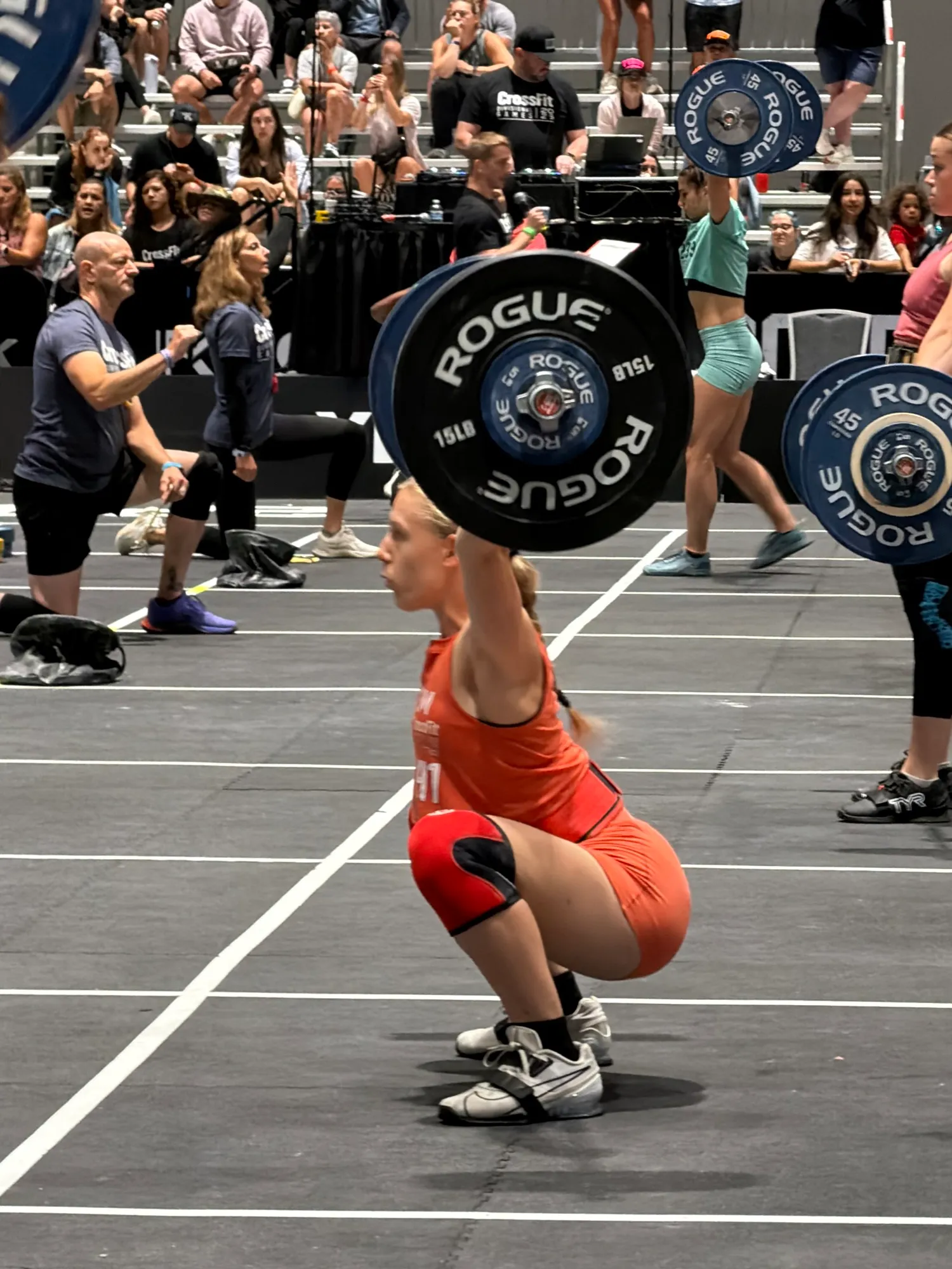 Lucy catching a snatch overhead on the Games floor, San Jose 2026